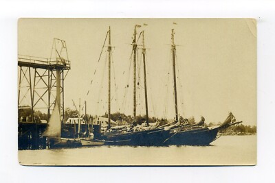 Working waterfront, ships at dock, RPPC photo postcard, pub - Boothbay Harbor ME