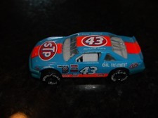 #43 RICHARD PETTY STP OIL TREATMENT NASCAR 1:64 scale pre-owned