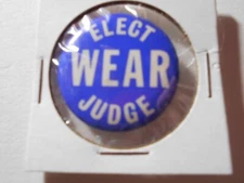1-1/4" Elect Wear Judge unknown location cello pinback button