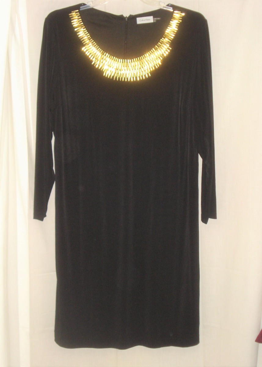 black dress with gold hardware SIGNATURE GOLD HARDWARE CUTOUT STRAPLESS COLUMN GOWN IN BLACK  AIIZIE