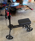 Black 4-Wheeled Mobility Scooter, 4-Wheel, with Seat and Front Basket — photo 1