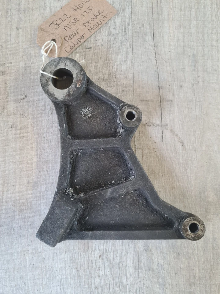 Placa de montaje de soporte de pinza de freno trasero Honda NSR125 NSR 125 JC22 Foto 2 de 4