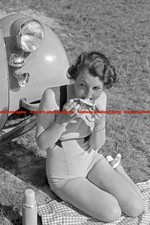 F000494 A young woman having a pick nick in front of a Ford V8 BdM Germany 1930s