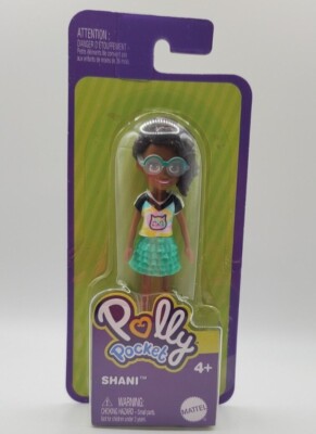 Polly Pocket Shani doll.  Green dress and green rimmed glasses
