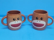 Brown Sock Monkey Double Handled Mugs Galerie lot of 2 mugs (TC)
