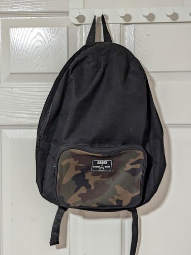 Primark Bronx Street Wear Mały plecak z kieszenią zapinaną na zamek czarny kamuflaż - Zdjęcie 1 z 3