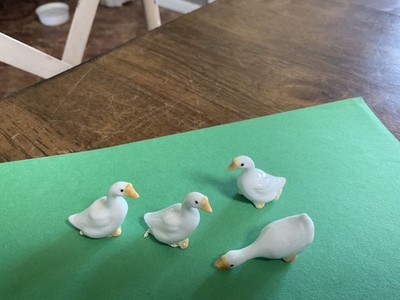 Darling vintage group of 4 geese made of ceramic blue, hand  painted.