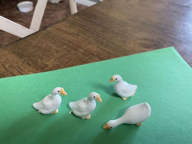 Darling vintage group of 4 geese made of ceramic blue, hand  painted.