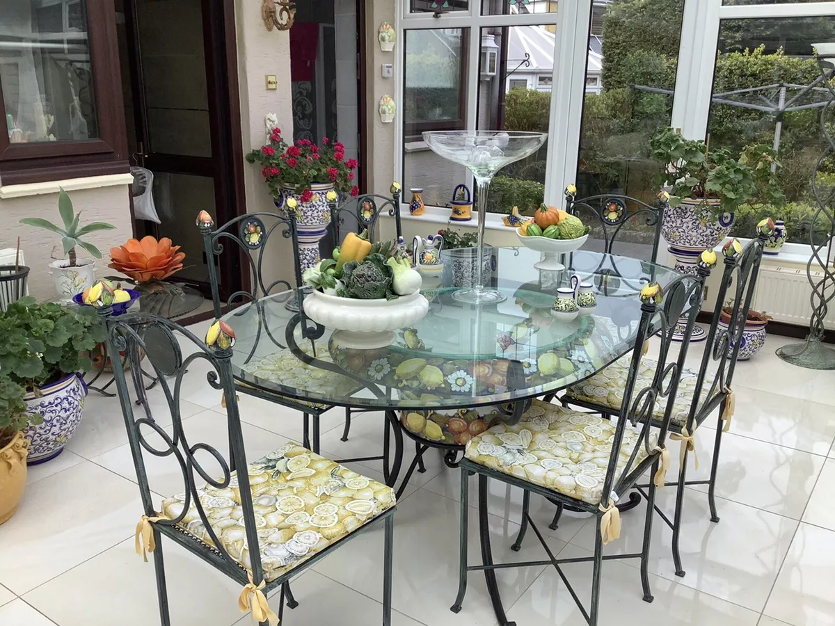 Wrought iron glass top dining table and chairs deals