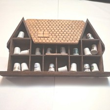 thimble storage shelf in shape of house. with selection of thimbles 19cm by 30cm