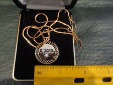 Vintage Arnold Machine 10k Gold Emblem attached to a pendent on a 14k GF Chain