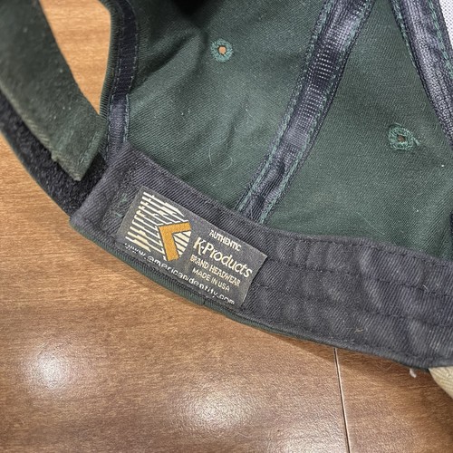 Green vintage baseball strapback hat with black brim, embroidered K-Products logo patch, and “Made in U.S.A.” text.