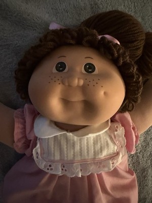 Cabbage Patch Kid Jesmar,  brown hair, brown eyes one dimple