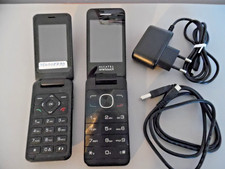 OLD FLIP UP PHONES. ( 2 ) WITH CHARGING LEADS, ONE INSTRUCTIONS. BOUGHT AS SEEN.