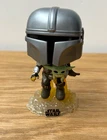 Funko Pop! Vinyl: Star Wars The Mandalorian with the Child Baby Yoda #402