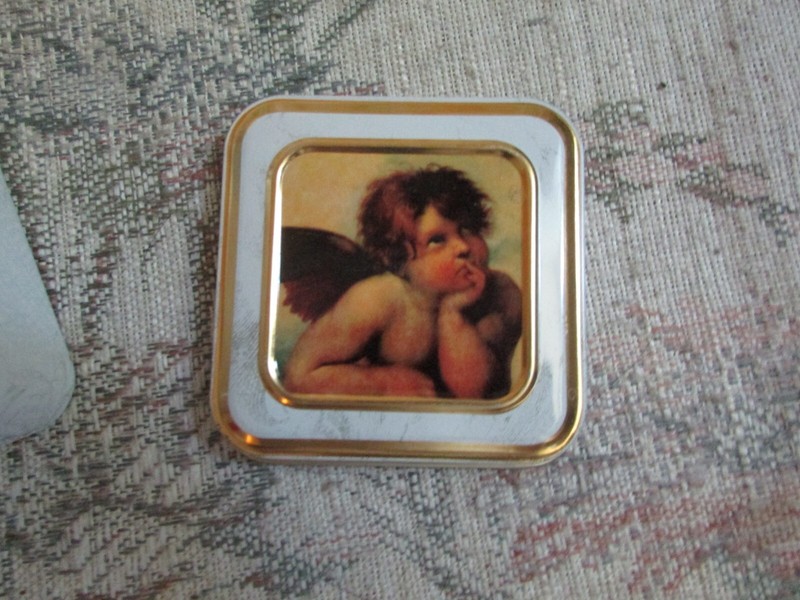 Small Thinking Angel Square Tin, 3" x 3" x 1 3/4", small dent in the lid