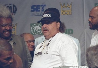 Mike Tyson's trainer Richard Giachetti looks on at a press confere- Old Photo