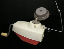 VINTAGE SILVER BRAND YARN WINDER WITH PINK METAL BOTTOM AND HARD PLASTIC TOP