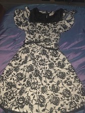Beautees brand girls' dress features a black and white floral pattern with a...