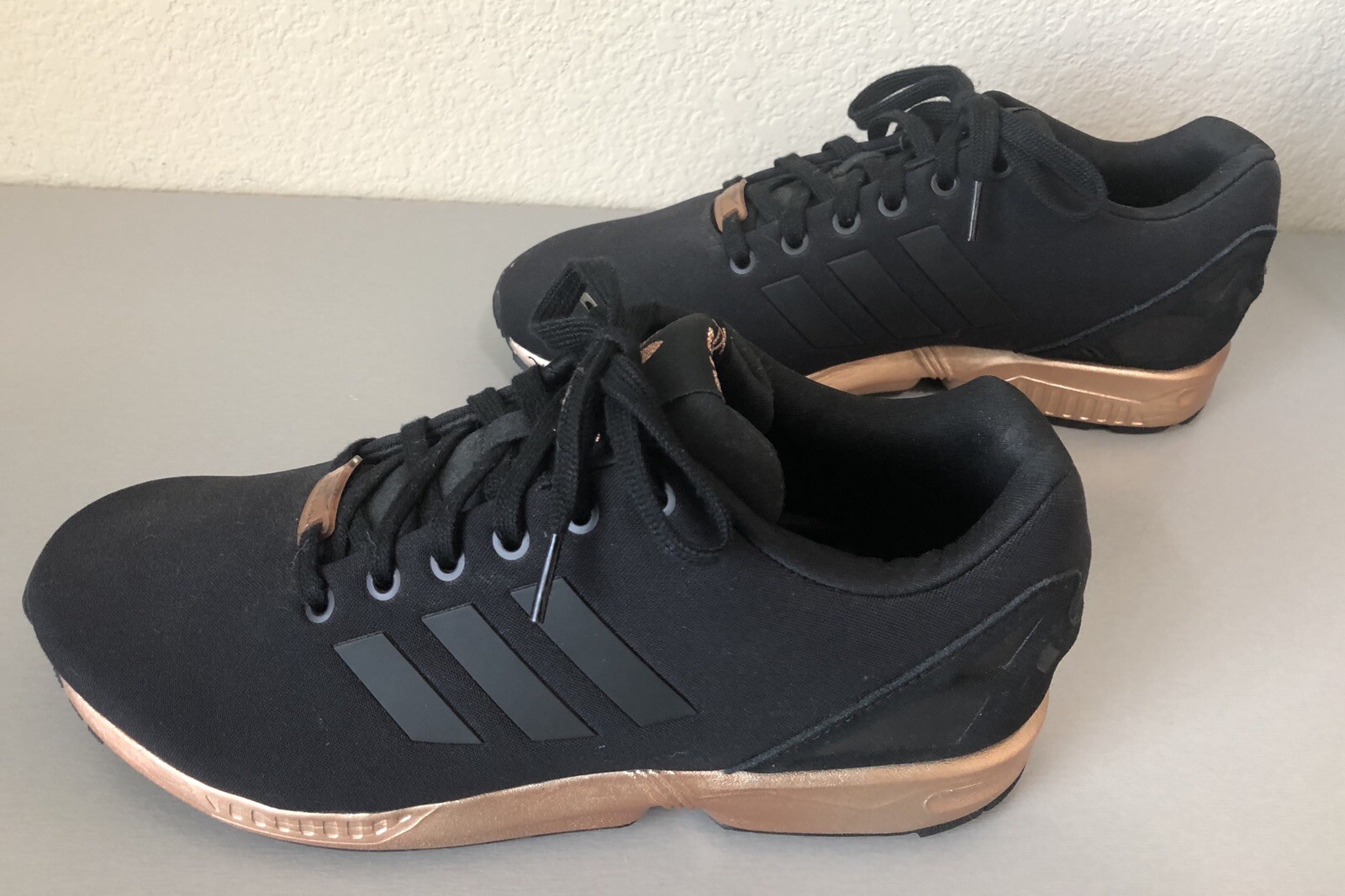 black adidas with rose gold