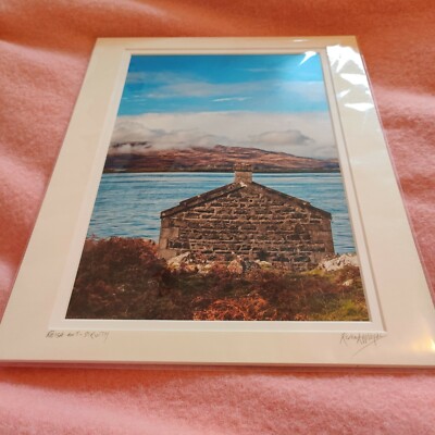 Framed as pic. house on a loch overlooking mountains in Scotland by K Appleyard