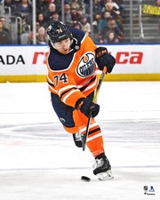Ethan Bear Edmonton Oilers Unsigned Orange Jersey Shooting Photo