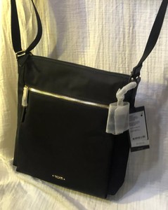 tumi voyageur canton crossbody bolsa