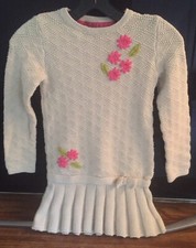 Children's knitted dress with a low waist.