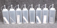 Lot of 8 Condiment Squeeze Dispense Bottles W/Cap W/ Gradients In mL & Oz