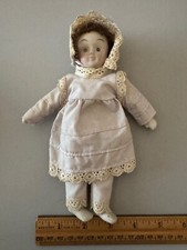 PAINTED BISQUE CLOTH BODY UNMARKED DOLL IN WHITE DRESS 7"