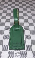Authentic Louis Vuitton small Green W/ Gold Hardware leather name tag.