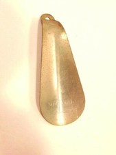 older metal advertising shoe horn: Nunn Bush Ankle Fashioned Oxfords