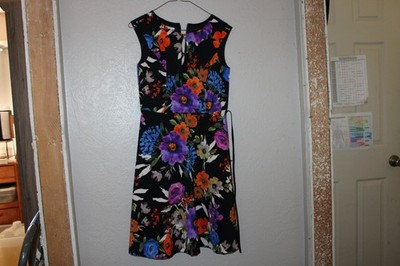 London times dress Size 4P, black with flowers. Has belt. Keyhole on front.