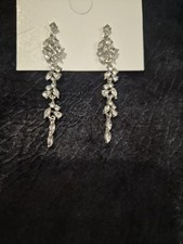 Unbranded silver drop earring feature a design made of sparkling cubic crystal
