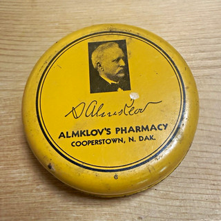 Almklov's Pharmacy X.E.M. Salve Round Advertising Tin Yellow/Black Cooperstown