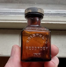 BRISTOL'S RECORDER INK WATERBURY,CONN AMBER BOTTLE WITH EMB RUBBER STOPPER