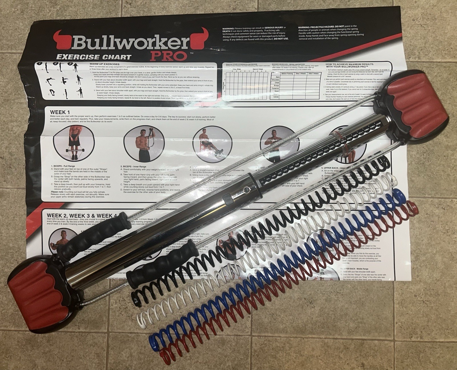 "Ejercitador isométrico Bullworker Pro 28"" con 5 resortes y tabla de ejercicios"
