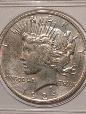 1924 P Peace Silver Dollar. AU condition.  Uncertified, ungraded.