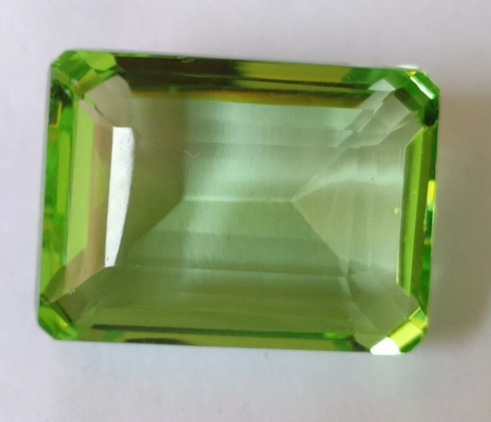 AAA+ 55.50 Ct. Green Peridot Translucent Faceted Emerald Cut Loose Gemstone Ring - Image 2 of 4
