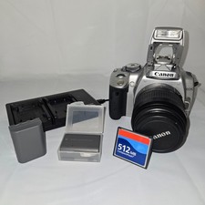 Canon REBEL XTi camera  extra battery  battery charger  SD Card