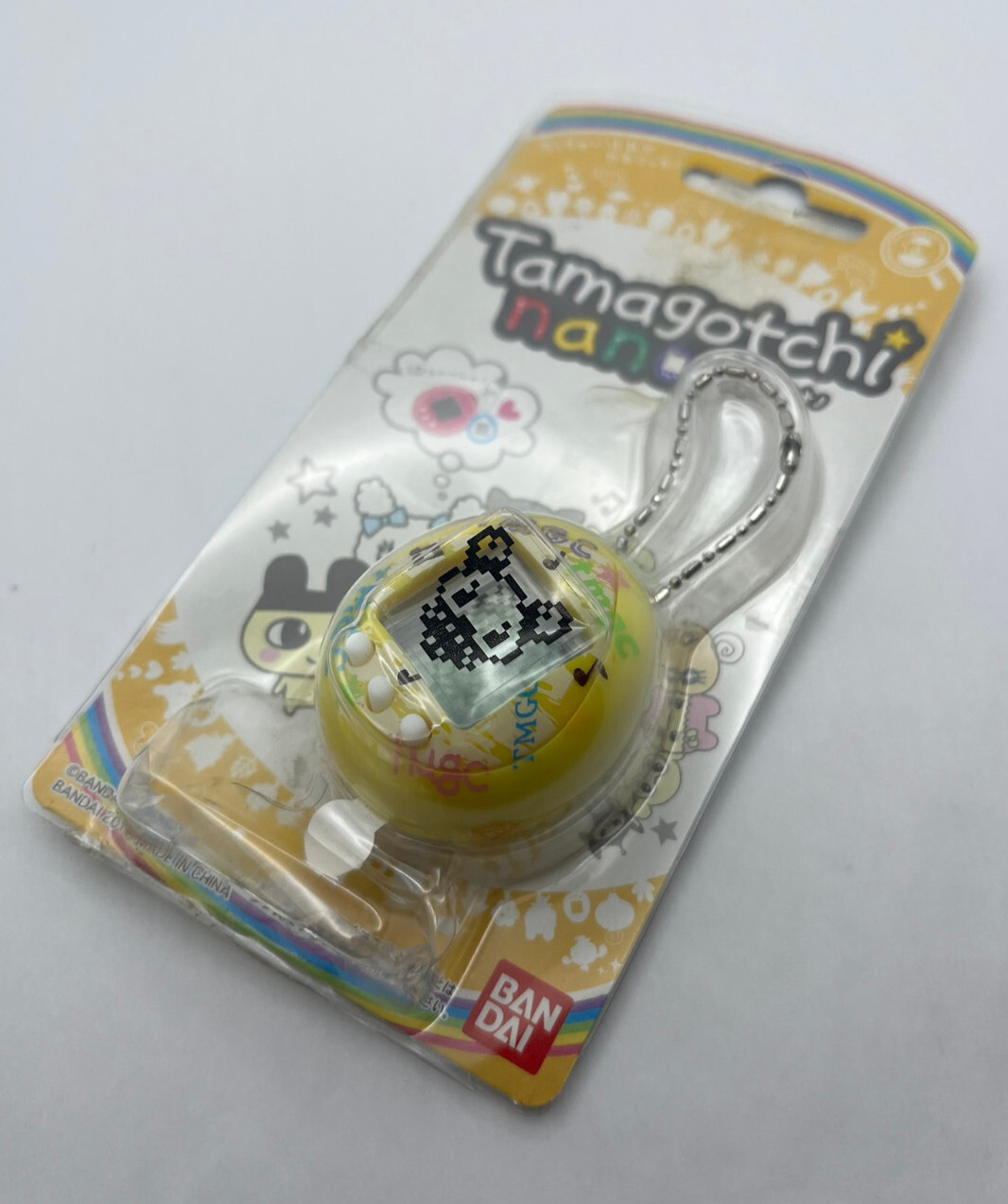 Tamagotchi Nano - Yellow Shell - Wave 1, Oct 2010 - Bandai Virtual Pet, Nuevo