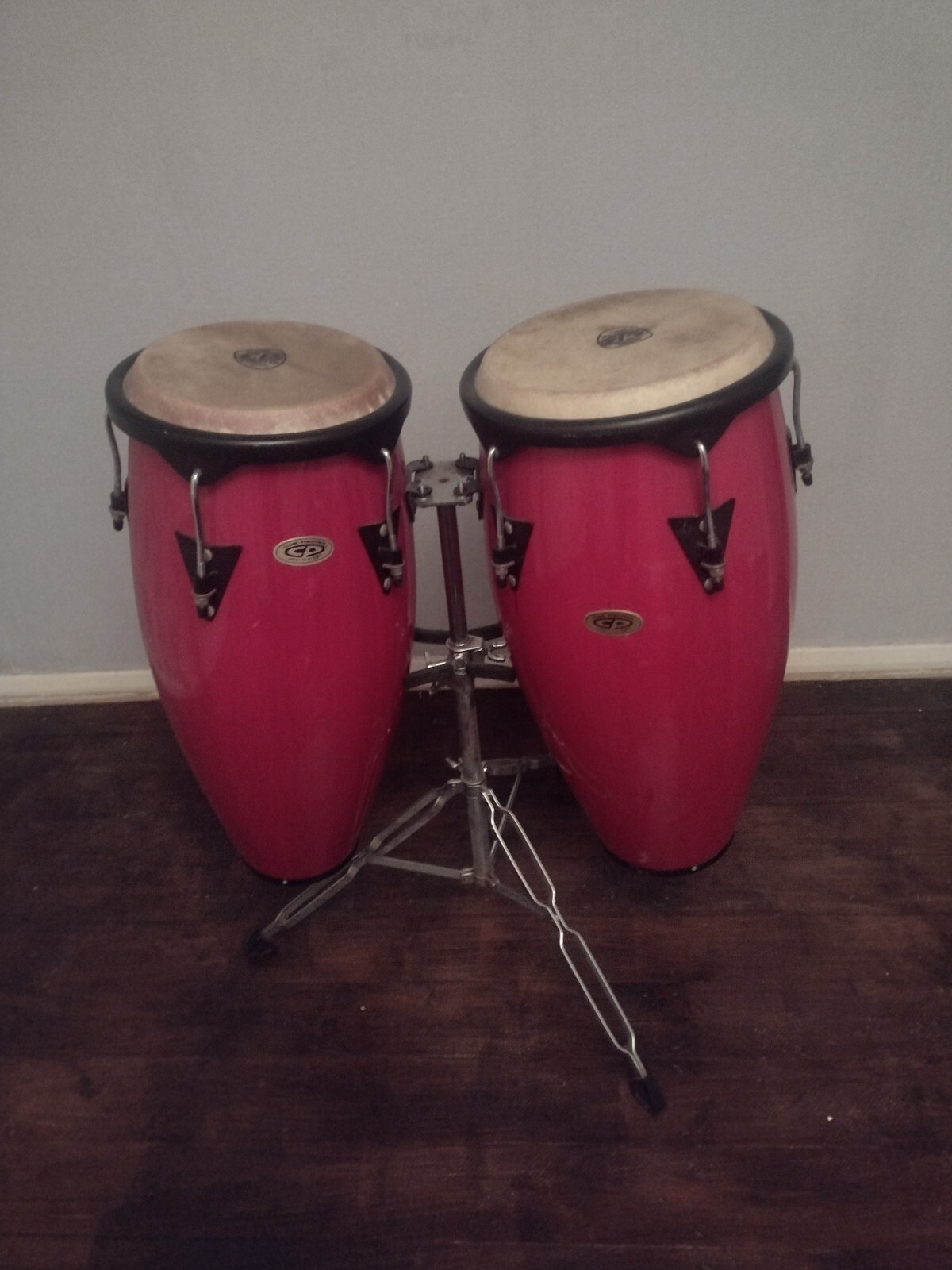 TWO COSMIC PERCUSSION CONGAS WITH STAND,BEAUTIFUL RED IN COLOUR,GOOD