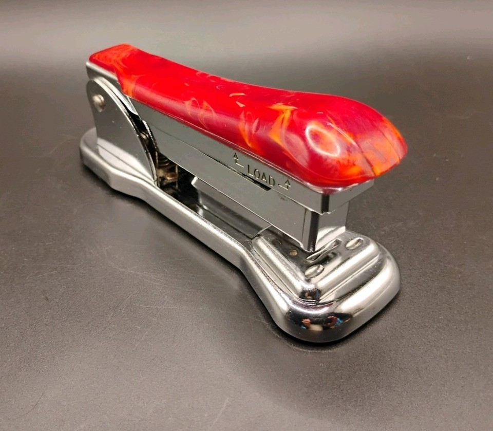 A burgundy marbled Bakelite Art Deco stapler that's genuinely beautiful — it belongs on a desk, not in a drawer.