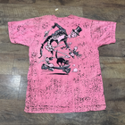 Pink vintage 80s Death Squadron T-shirt with cartoon skeleton, black cat, and bold yellow “USA Made” text on back.