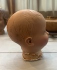 Antique 40’s Plastic Baby Doll Head Parts Sleepy Eyes on Wood Display Stand — photo 4