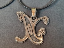 Xena princess warrior silver pendant in the shape of the letter X. Sterling.