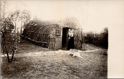 PILGRIM Woman Standing in Front a Thatched Hut Real Photo Postcard