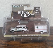 Greenlight Hitch & Tow 1/64 2015 Ford Explorer NYC Parks and Small Cargo Trailer