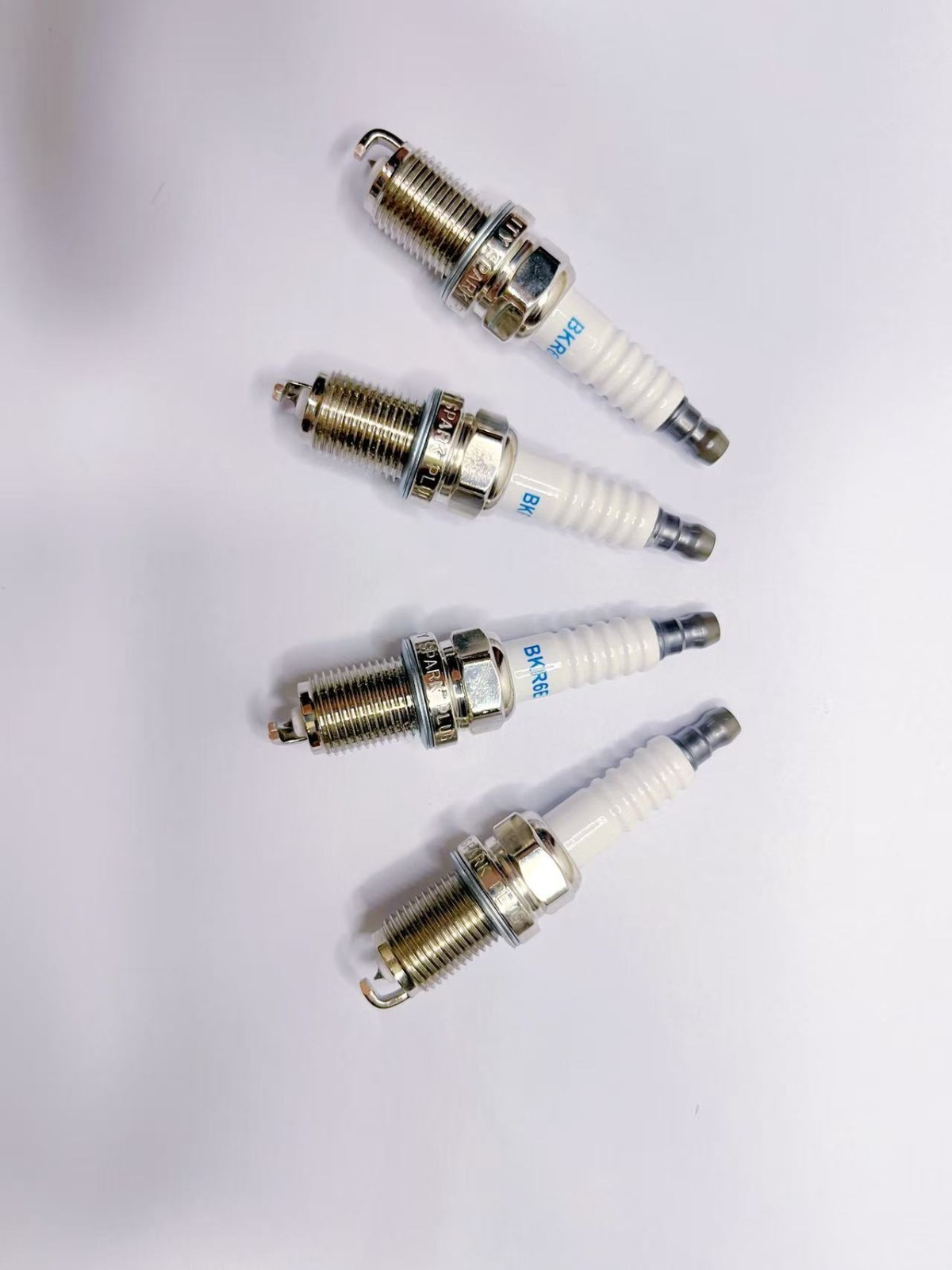 4 pieces sparkplugs are compatible with Toyota Corolla and Nissan Bluebird