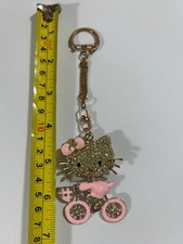 MLKA Hello Kitty Cristal Bicicleta Llavero Raro Tono Dorado Lujo Bolso Sanrio Dije